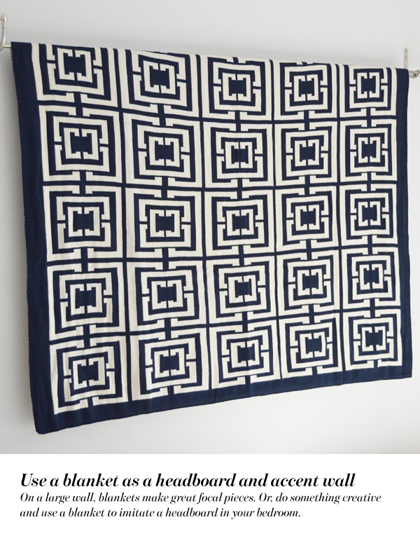 Use a blanket as a headboard and accent wall